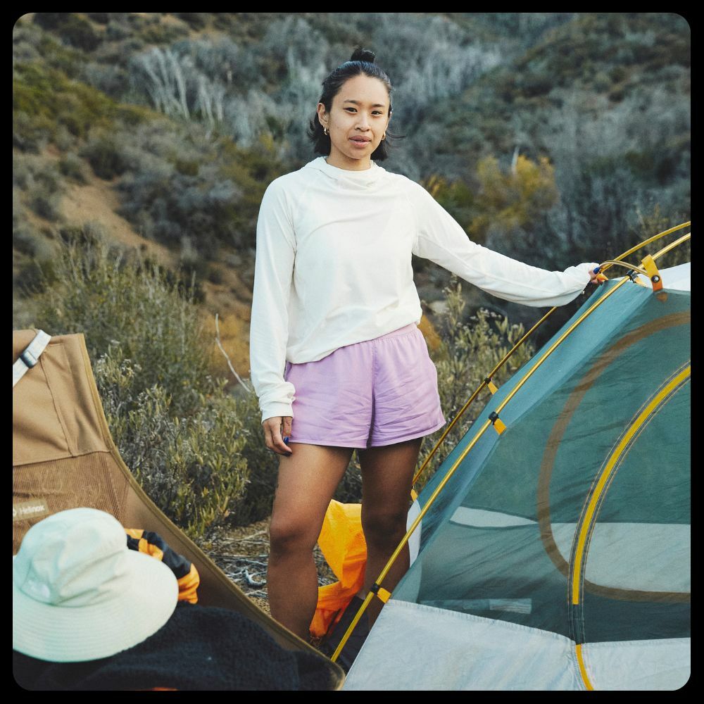 A woman wearing a The North Face beanie and Vest