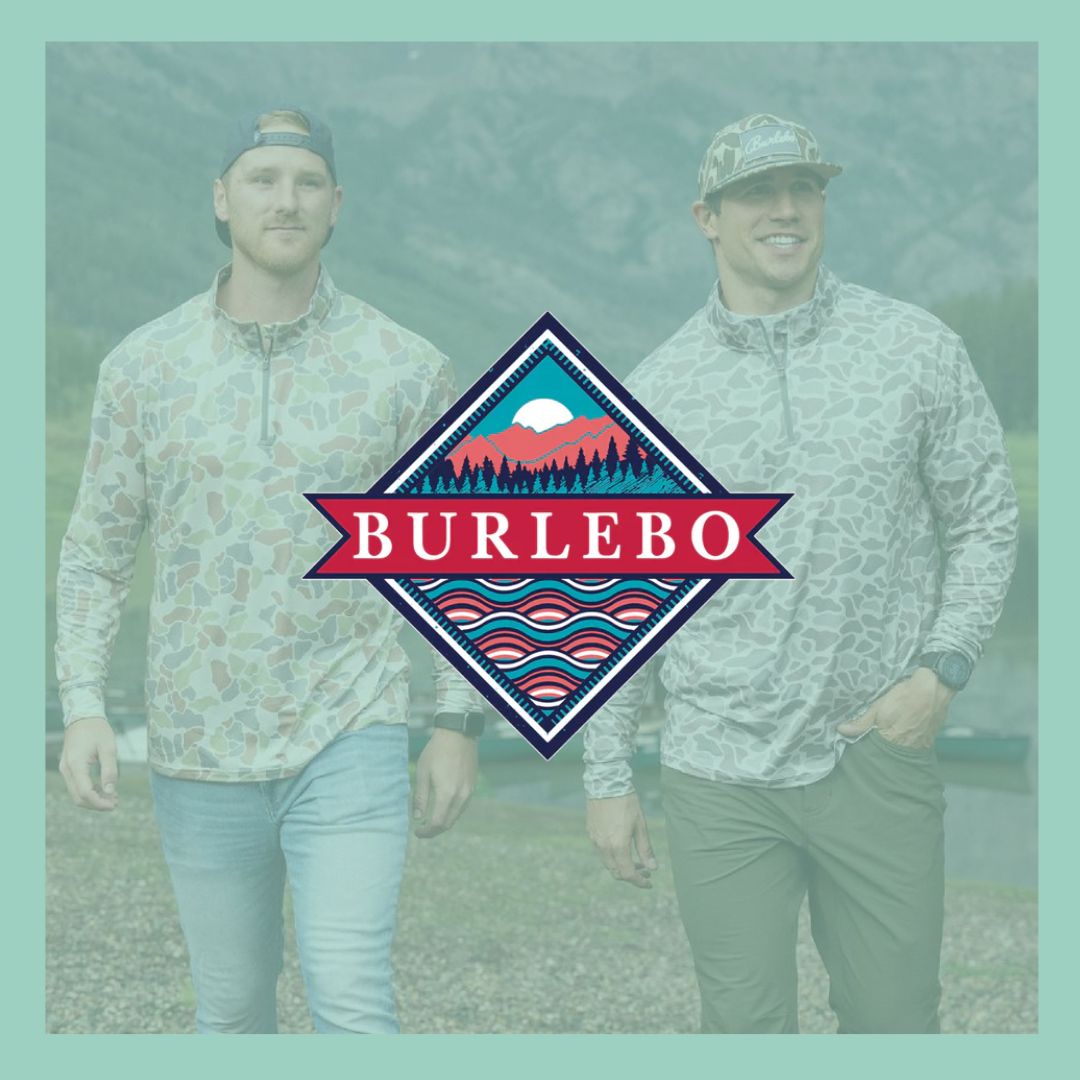 Men's Burlebo Fall Outdoor Apparel. Two men standing infront of a mountain scene wearing Burlebo quarter zip camo pullovers and baseball caps.