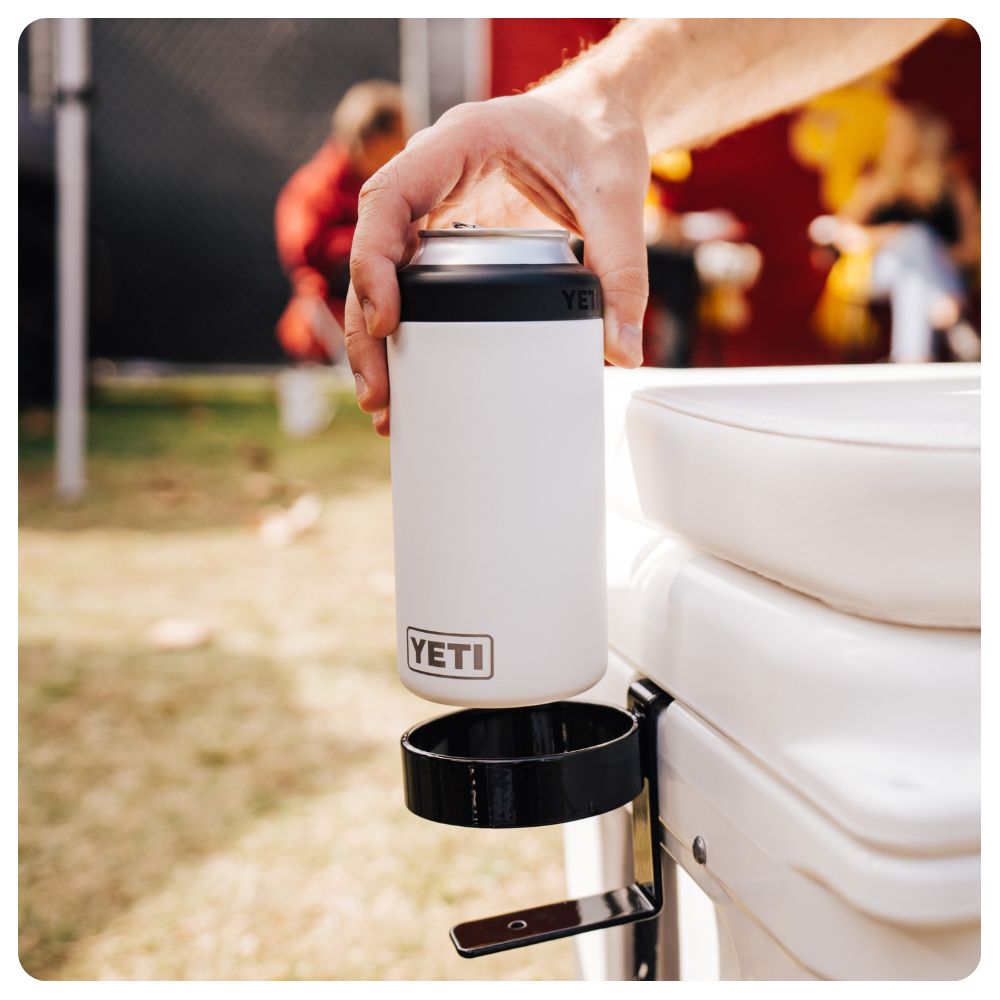 A hand putting a Yeti Rambler Can Colster into a Cooler Cup Holder Accessory