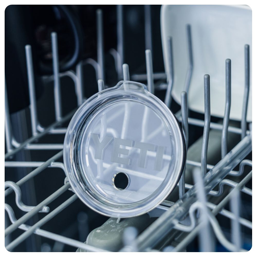 A Yeti tumbler lid in the dishwasher