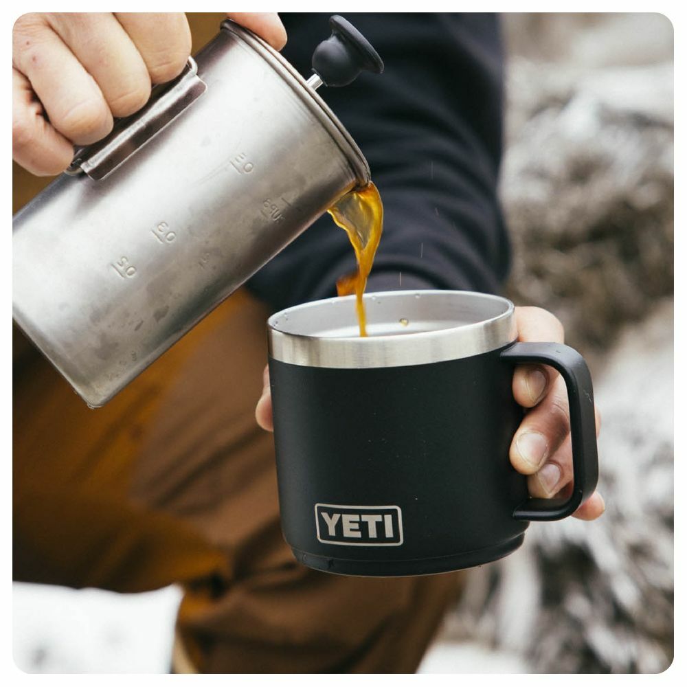 Man pouring coffee into Yeti Rambler 14oz Mug