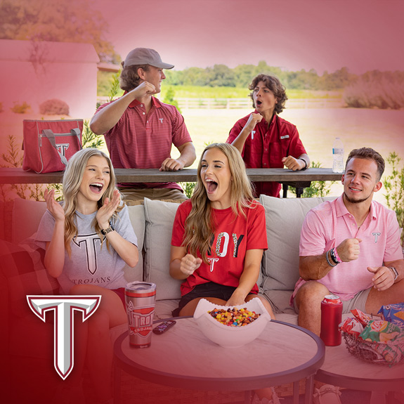 Troy University  Southern Collegiate Apparel. Group of students cheering wearing Troy University t-shirts, polos and shirts.