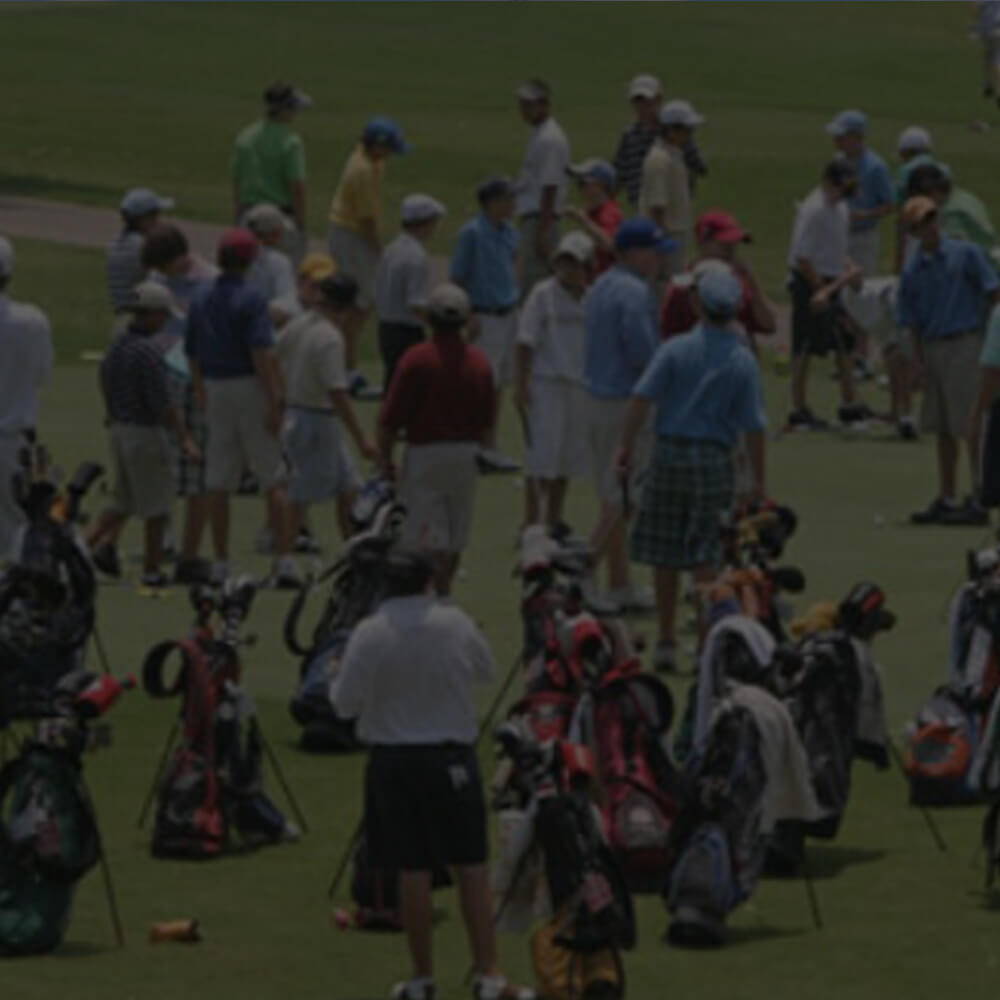 Image of a golf players hanging out on a golf course waiting for a golf tournament to start.