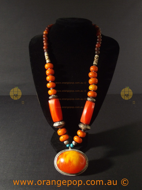 Large orange swirled pendant women's necklace