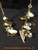 Mixed charms, shell, love heart gold colour necklace