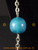 Long silver colour chain with big blue bead features