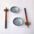 Ceramic sushi dish set for 2, including 2 pieces round sushi sauce dishes, 2 pairs chopsticks, 2 pieces chopstick holder.
