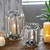 Decorative hurricane candle lamp also perfect with succulents of flowers as a vase.