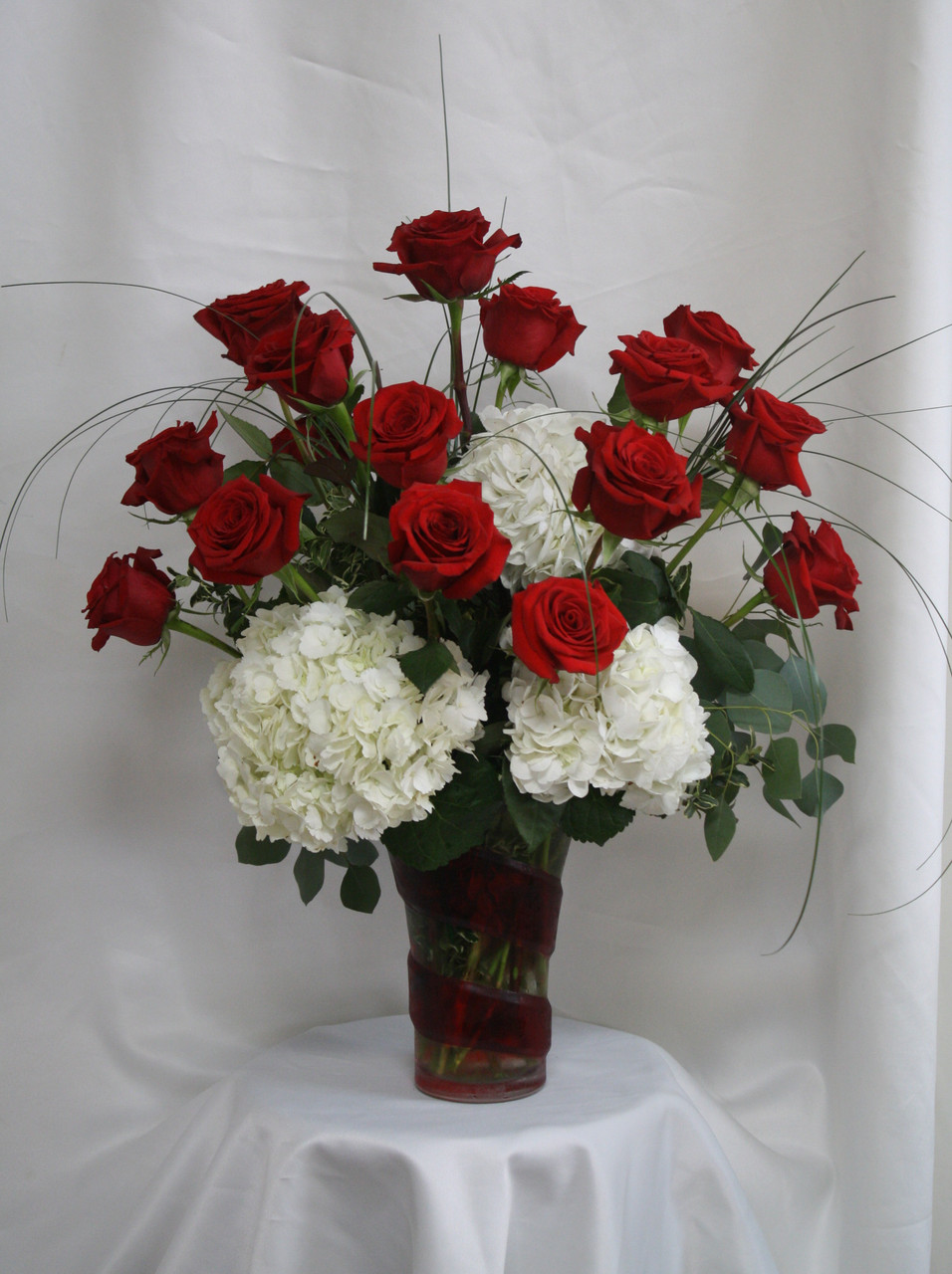 White hydrangea and red rose bouquet clearance