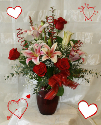 My Heart is Yours this Valentines Day by Enchanted Florist. Nothing says love like a romantic bouquet of star gazer lilies and red roses in a red vase with baby's breath. Also includes 3 glitter spadoodle sticks. Show her you're heart belongs to her this Valentines Day. RM934