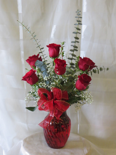 Half Dozen Roses in Red Vase by Enchanted Florist Pasadena TX.  6 premium red Ecuadorian roses in a n upgraded red vase with upgraded tropical foliages. Send red roses in Pasadena TX. RM354