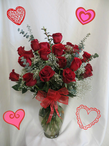 Red Two Dozen Roses for Valentines Day with baby's breath by Enchanted Florist Pasadena TX. This show stopping bouquets of our lush and romantic red roses comes complete with baby's breath, greens and a bow and is hand arranged by our premier floral designers. RM908