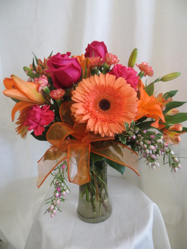 Our beautiful Luscious Hot Pink & Orange Gerbera Bouquet is a beautiful statement of love. This bright pink and orange bouquet of flowers includes hot pink roses and  carnations with orange lilies and gerbera daises for delivery in Webster TX and surrounding areas.  Hot Pink Gerbera Bouquet. RM168