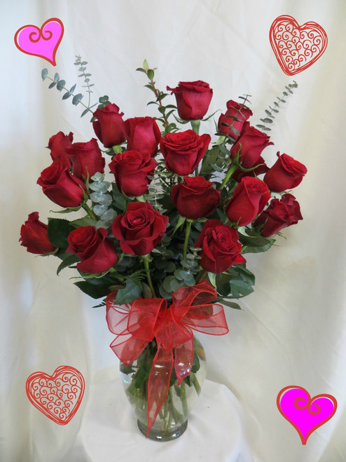 Two Dozen Roses for Valentines Day RED by Enchanted Florist Pasadena TX. This show stopping bouquets of our lush and romantic red roses comes complete with greens and a bow and is hand arranged by our premier floral designers. RM907