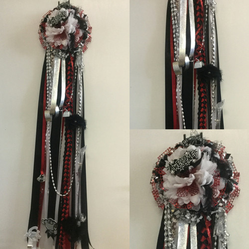 The Clear Brook Homecoming Mum from Enchanted Florist includes a single mum flower, trinkets, chains, and the Military braid in Clear Brook High School colors, but can be created in the school colors of your choice. 