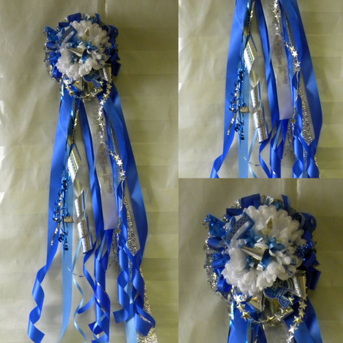 The Deluxe Sam Rayburn High School Homecoming Mum from Enchanted Florist can be designed in any color for any school. It includes a single mum flower and trinkets as shown. 
All our mums come with a bell, 2 names, and what is shown in the picture.  HMC125