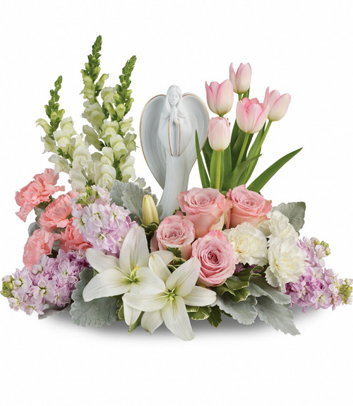 Pink Garden of Hope Flowers with Angel Statue from Enchanted Florist. This lovely arrangement includes light pink roses, light pink tulips, white oriental lilies, light pink carnations, white snapdragons, white carnations, and light pink stock is accented with white filler flowers and assorted greenery. Flowers are delivered with Angel statue. Pearland funeral flowers. SKU RM558