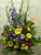 Spring Time Funeral Flower Arrangement by Enchanted Florist Pasadena TX - a lush funeral arrangement of purple gladiolas, blue delphinium, yellow gerbera daisies, and hot pink carnations. Can be delivered same day or next day to most Funeral Homes in Clear Lake TX and Houston TX. RM512