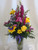 Purple People Pleaser Flower Bouquet with Yellow Roses and Gerberas by Enchanted Florist Pasadena TX. Bright yellows and pleasing purple flowers in a clear glass vase. Flowers include purples and yellow roses and purple carnations. RM162