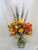 Fall Simply Spray Rose Bouquet by Enchanted Florist Pasadena TX. Our fall bouquet of yellow and orange spray roses in a clear vase with wheat accents and fall leaves perfect for a side table or desk. We offer same day delivery on fall flowers for delivery in Pasadena TX and surrounding areas. RM206