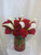 Forever Love Red Rose Flower Bouquet by Enchanted Florist Pasadena TX. She will run to your embrace after having these stunning flowers delivered to her home or office. This luscious bouquet arrives in a contemporary cylinder vase accented with red rocks and is filled with 15 red roses and white miniature calla lilies.  Approximate size is 15"H x 13"W  For local delivery only.  
SKU RM146