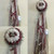 The Maroon and White Homecoming Mum from Enchanted Florist includes a single mum flower, trinkets, chains, and the Military braid in maroon and white, but can be created in the school colors of your choice. HMC113