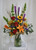 Fantastically Fall Red Rose Bouquet from Enchanted Florist. Your fall arrangement includes orange Asiatic lilies, sunflowers, red roses, purple liatris, bronze spiders, bells of Ireland and assorted greenery for a fall floral bouquet to enjoy. Approximately 18"W x 30"H
SKU RM214