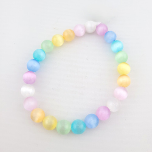 Colored selenite crystal bead bracelet laid flat, full circle product view