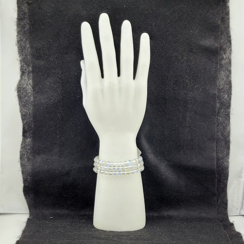 Iridescent Angel Aura Clear Quartz bead bracelet on a white mannequin hand display.