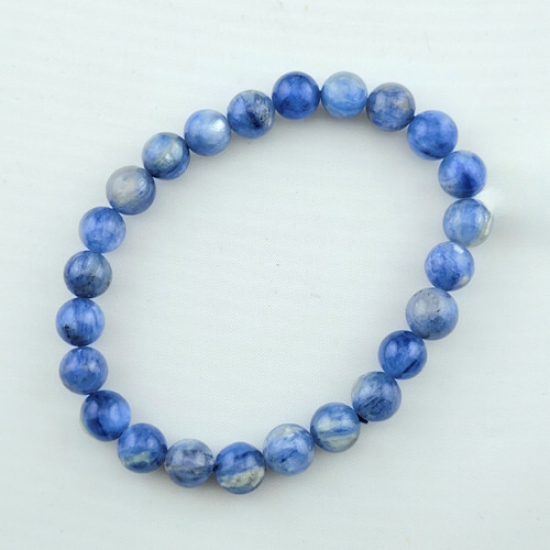 Overhead view of a natural Blue Kyanite bracelet showing the unique mineral variations in each bead.