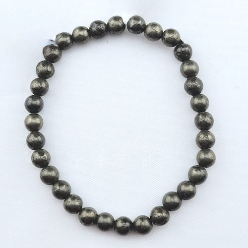 A single Pyrite stretch bracelet laid flat on a clean white surface highlighting the uniform round beads.