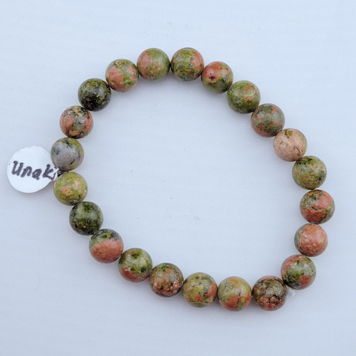 A single Unakite stretch bracelet featuring 8mm polished green and pink mottled beads on a white background.