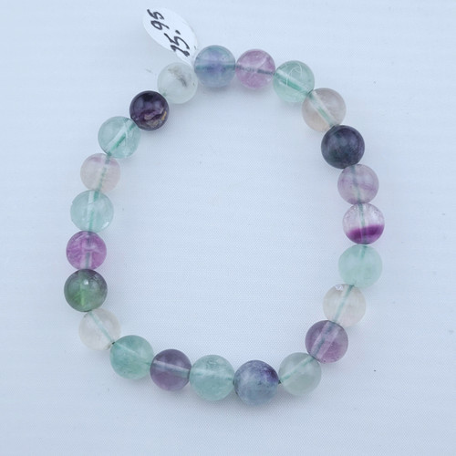 A Fluorite stretch bracelet featuring 8mm translucent green and purple polished beads.