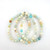 Amazonite 6mm bead bracelets arranged in a flat lay showing natural color variation in pastel gemstone beads.