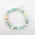 Single amazonite 8mm bead bracelet with larger natural gemstone beads displayed on a white background.