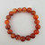 Natural carnelian crystal bracelet showing banded translucent stones