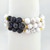 Close-up of Howlite and lava stone bracelet with white marbled beads and black porous lava stones.