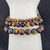 Close-up of Triple tiger eye bead bracelet showing mixed gold red and blue tiger eye stones