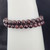 Garnet bead 8mm bracelet close-up showing deep red polished stones
