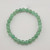 Green aventurine 6mm bead bracelet photographed from top angle