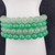 Close-up of green aventurine 8mm polished gemstone beads on bracelet