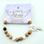 Archangel Mikael charm bracelet front view on a white background