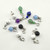 A collection of individual bracelet charms including Amethyst, Green Aventurine, and Lapis Lazuli with silver attachments.