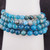 Close-up detail of Blue Apatite beads showing the intense blue color and unique internal fibrous textures.