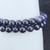 Close-up of Blue Goldstone beads highlighting the starry-night sparkle and smooth polished surface.
