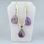 An Amethyst teardrop gemstone jewelry set including a pendant on a braided cord and matching drop earrings.