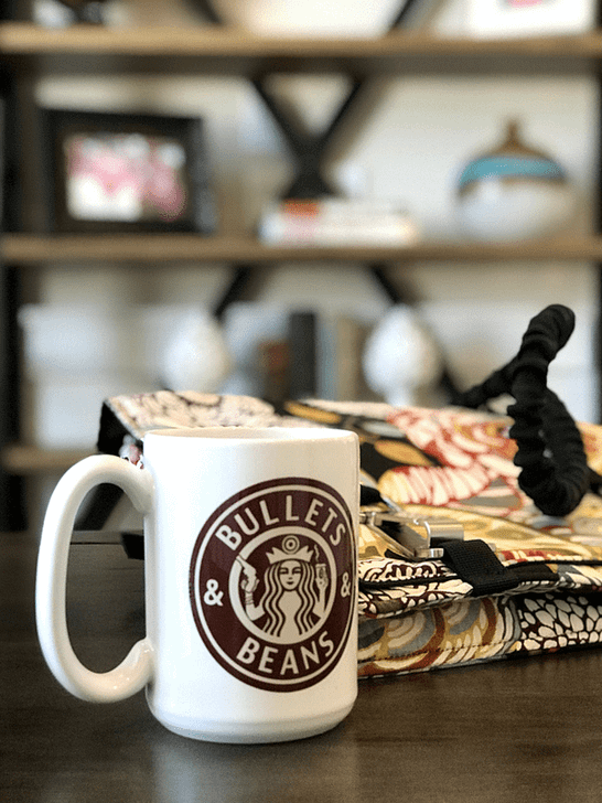 Bullets and Beans large 15oz mega mug with floral NORB on desk