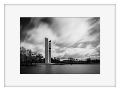 Black and white image of the suins of Mount Stromlo in a black frame