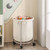 Round 45-Gallon Laundry Basket Hamper w/ Cream Fabric Bag Steel Frame on Wheels Round 45-Gallon Laundry Basket Hamper w/ Cream Fabric Bag Steel Frame on Wheels