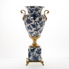 Lyvrich d'Elegance, | Porcelain and Gilded Dior Ormolu, | Blue and White Flora with Soft Gold, | Potiche Vase on Plinth, | Trophy Cup Statement Centerpiece, | 21.67t X 11.74w X 8.43d | 6365